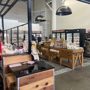 a man in a red shirt at the counter