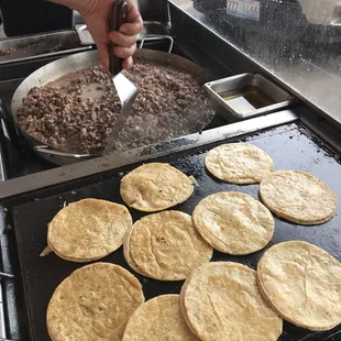 Cooking the famous stake tacos with tortilla.