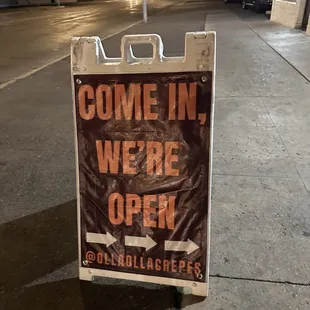 a sign that says come in, we&apos;re open