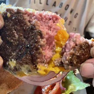 Raw burger...and so greasy the bottom bun literally stuck to the plate