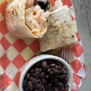 Shrimp wrap with side of rice and beans