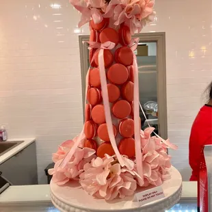 a cake made of macarons and flowers