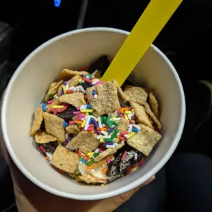 Vegan vanilla froyo with sprinkles, peanut butter, oreos, and cinnamon toast crunch
