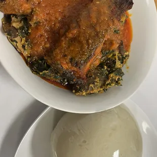 Stewed chicken and fish, over okro with fufu