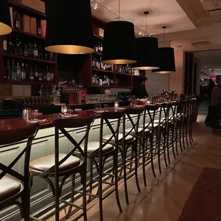 a row of bar stools in a restaurant