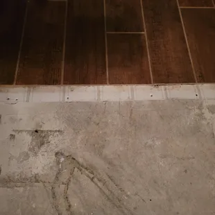 a bathroom floor being remodeled