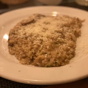 a plate of risotto with parmesan cheese