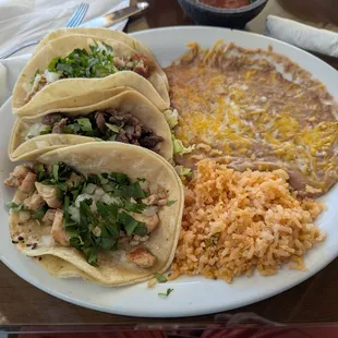 Tecate tacos with asada carnitas &amp; chicken with rice and beans