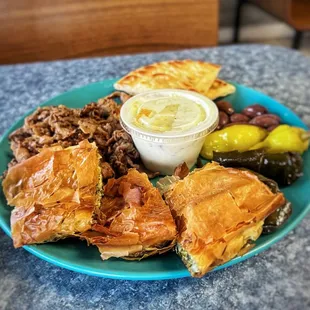 GREEK COMBO $17.49 Gyro Meat (Lamb, Beef or Chicken) Pita Bread, Spinach Ple &amp; 2 Dolmades