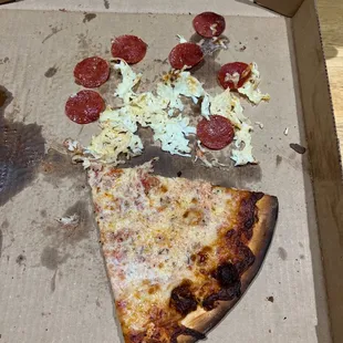 a half eaten pizza in a box