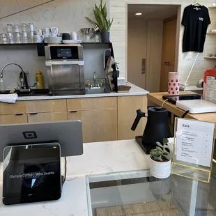 a coffee maker and a coffee pot on a counter