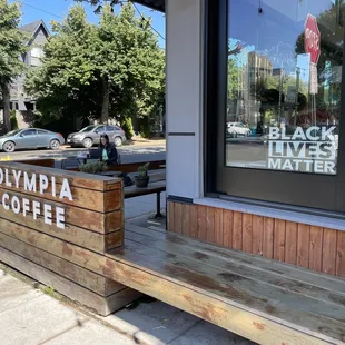 a bench outside of a coffee shop