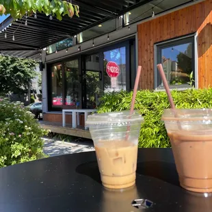 two cups of iced coffee on a table