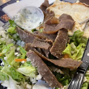 a plate of food with a fork and knife