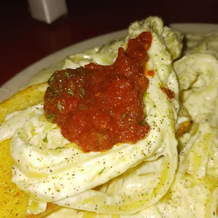 Creamy delicious Alfredo and tomato Marinara combination!