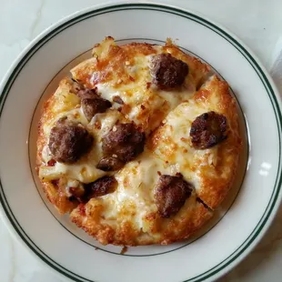 Sausage and pineapple personal pizza with thick crust. Yummy. :)