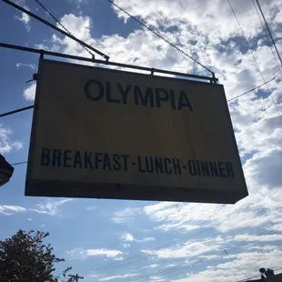 a sign for a breakfast lunch dinner