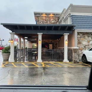 a car parked in front of a restaurant