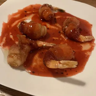 Bacon wrapped shrimp with a raspberry vinaigrette. It was an odd combination, but not bad.