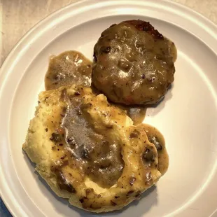 Meatloaf with mashed potatoes and gravy.