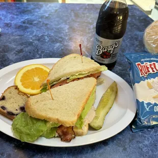 Club sandwich, came with chips, pickle, blueberry bread slice and a slice of orange. I also got a root beer and a loaf of rosemary bread.