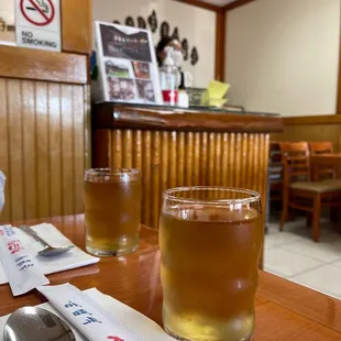 two glasses of beer on a table