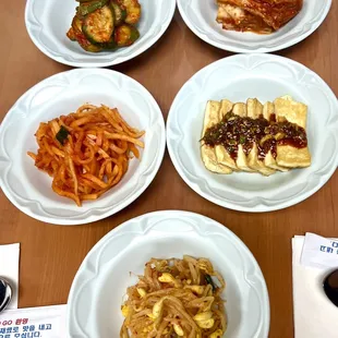 5 dishes of good BanChan: pickled cucumbers, kimchi, seasoned radish strips, fried tofu &amp; bean sprouts