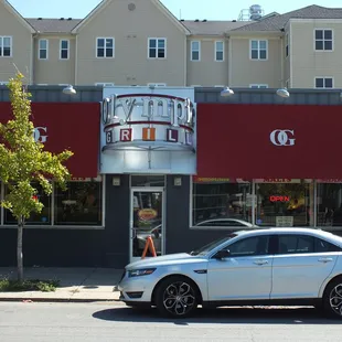 a car parked in front of a restaurant