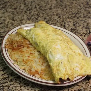 a plate of omelet and a napkin