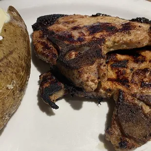 Grilled pork chops and baked potato