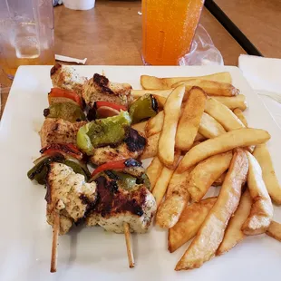 chicken skewers and french fries