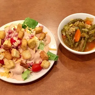 a salad and a bowl of soup