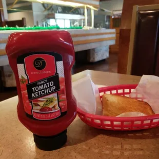 tomato ketchup and a basket of bread