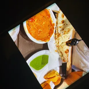 a bowl of soup and tortillas