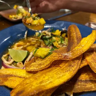 Happy people eating omsabor food at phonobar. Some plantains and crab cakes