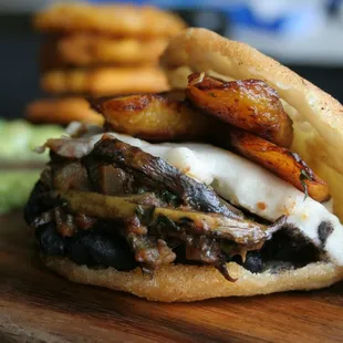 Arepa de Pabellon Criollo Venezuelan Corn Cakes stuffed with Plantains, Beans, Cheese, Sauteed Plantain Skins