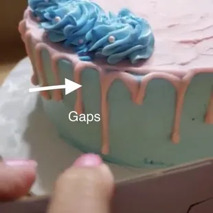 a person cutting a cake with a knife
