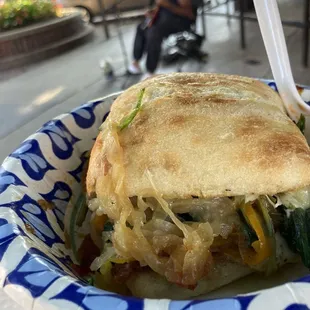 Breakfast sandwich and serenade. Sandwich by Slightly Cracked.