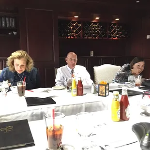 a group of people sitting at a table