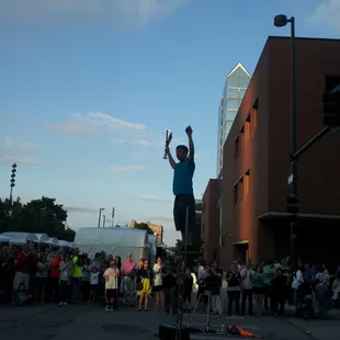 Best street performer yet. Fire, blade, and apple on a ladder
