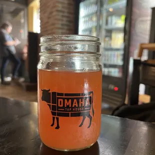 a glass jar of drink