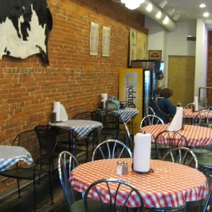 a brick wall with a cow on it