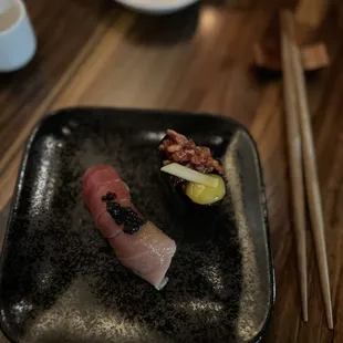 a close up of a plate of sushi