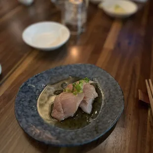 a plate of food on a wooden table