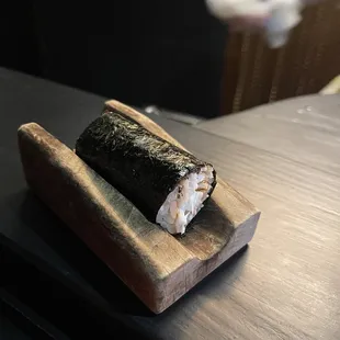 a sushi roll on a cutting board
