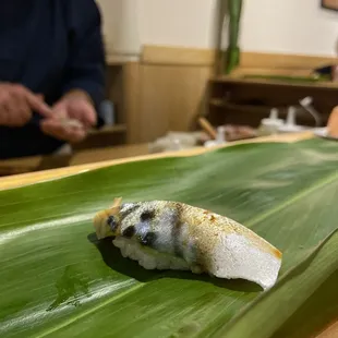 a sushi on a banana leaf