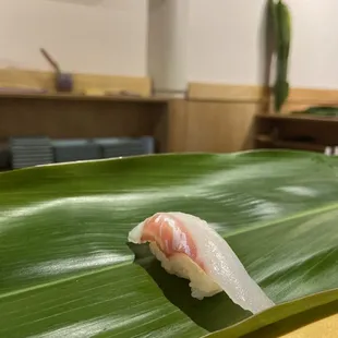 a sushi on a banana leaf