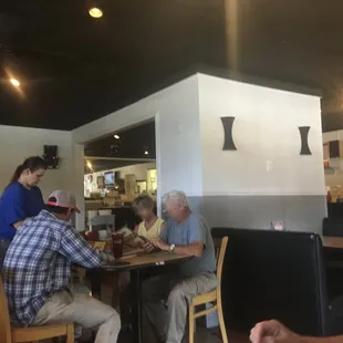 a group of people sitting at a table