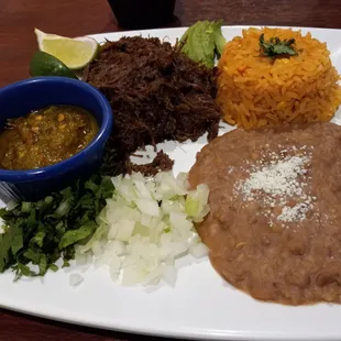 Barbacoa Plate  $17.99  Barbacoa meat, Salsa Verde, cilantro and onions on the side with rice, beans, sliced avocado and tortillas $17.99