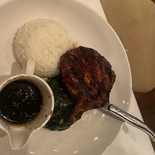 Teriyaki Glazed bone in Pork chop with spinach and rice. -chef special